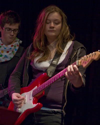 Stephanie playing the Guitar